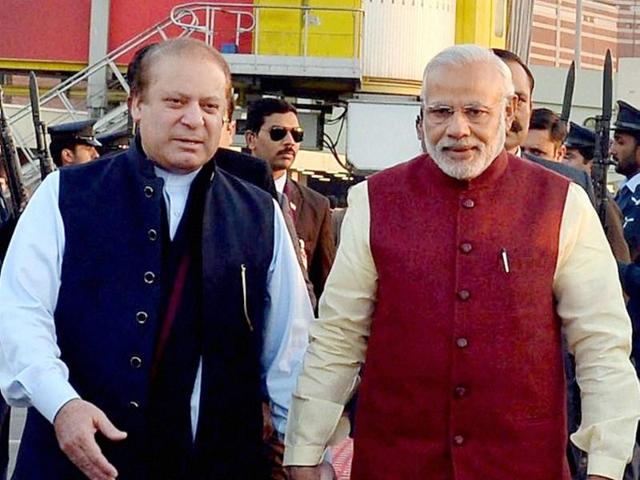 Prime Minister Narendra Modi and his Pakistani counterpart Nawaz Sharif look on during a meeting in Lahore. Pakistan’s defence minister said the country is itself a victim of terrorism after militants believed to be from Pakistan attacked the Pathankot air force base in India. (PIB via AFP Photo)