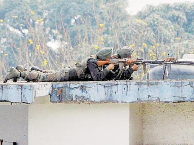 Soldiers on the top of a building at the Indian air force base in Pathankot on Wednesday, a day after the end of military operations against militants. (PTI) Soldiers on the top of a building at the Indian air force base in Pathankot on Wednesday, a day after the end of military operations against militants. (PTI)