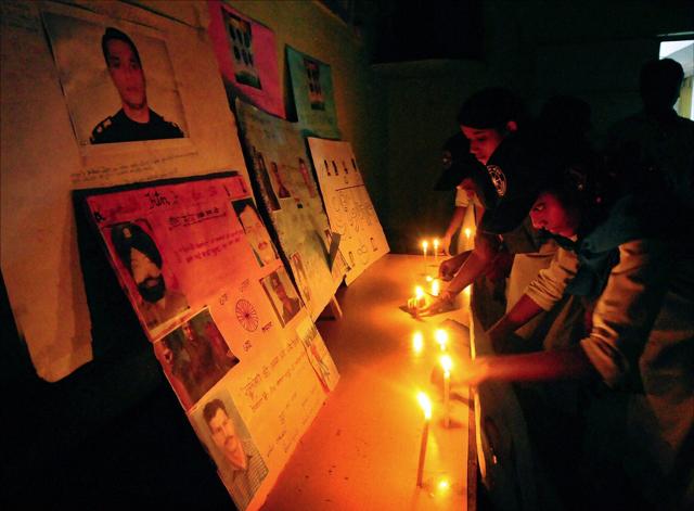 School students pay tribute to Pathankot martyrs in Ahmedabad on Tuesday. (PTI) School students pay tribute to Pathankot martyrs in Ahmedabad on Tuesday. (PTI)