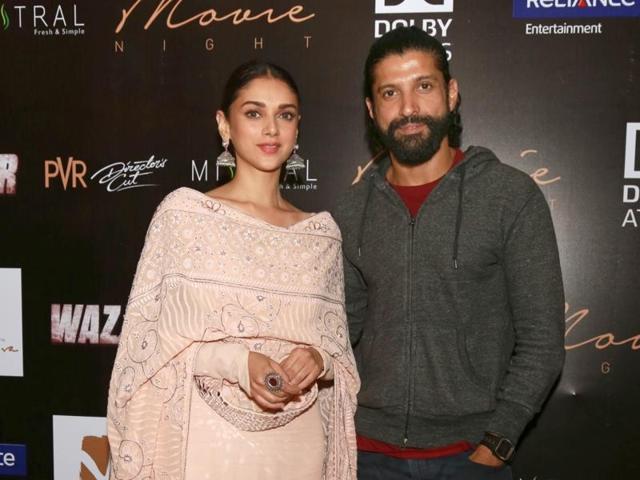 Farhan Akhtar and Aditi Rao Hydari pose for the shutterbugs as they promote Wazir in New Delhi.  (IANS) 