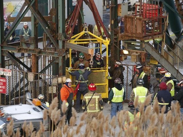 The fourth group of workers emerge from an elevator after they were stuck overnight in a shaft at the Cayuga Salt Mine. (AP) The fourth group of workers emerge from an elevator after they were stuck overnight in a shaft at the Cayuga Salt Mine. (AP)