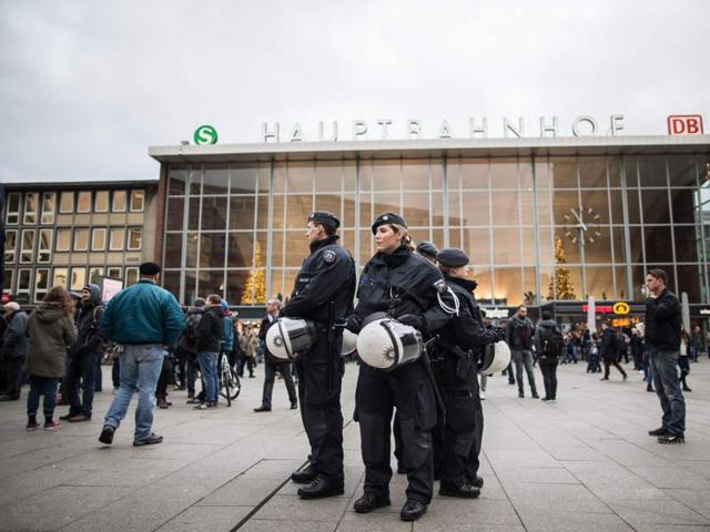 Police officers survey the area in front of the main train station and the Cathedral in Cologne, western Germany, on January 6, 2016, where dozens of apparently coordinated sexual assaults were perpetred against women on New Year's Eve. (AFP) Police officers survey the area in front of the main train station and the Cathedral in Cologne, western Germany, on January 6, 2016, where dozens of apparently coordinated sexual assaults were perpetred against women on New Year's Eve. (AFP)