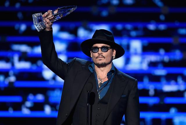 Johnny Depp accepts Favourite Dramatic Movie Actor award onstage during the People's Choice Awards 2016. (AFP)