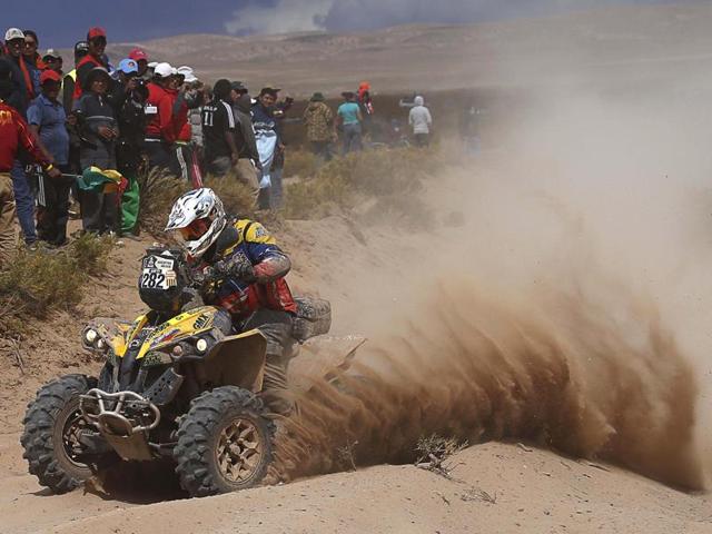 Can-Am rider Eduardo Marcos Echamiz, of Spain, races his quad during in the Dakar Rally. (AP Photo/Juan Karita)