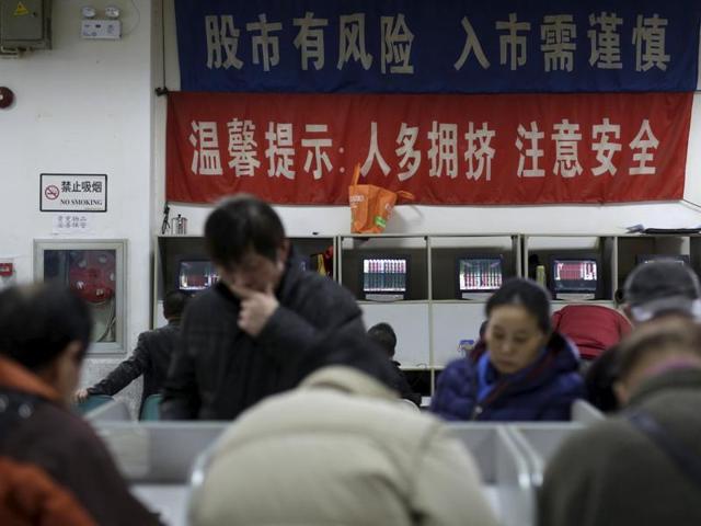 An investor looks at a screen showing stock information at a brokerage house in Shanghai, China, January 8, 2016. China's major stock indexes opened higher on Friday after Beijing ditched a circuit breaker mechanism that halted trading twice this week when share prices tumbled and had been blamed for exacerbating the market sell-offs. (REUTERS) An investor looks at a screen showing stock information at a brokerage house in Shanghai, China, January 8, 2016. China's major stock indexes opened higher on Friday after Beijing ditched a circuit breaker mechanism that halted trading twice this week when share prices tumbled and had been blamed for exacerbating the market sell-offs. (REUTERS)