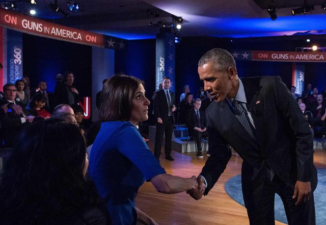 US President Barack Obama greets Taya Kyle, widow of Navy Seal Chris Kyle, made famous by the film "American Sniper," during a commercial break at a town hall meeting with CNN's Anderson Cooper on reducing gun violence at George Mason University in Fairfax, Virginia, on January 7, 2016. (AFP Photo) US President Barack Obama greets Taya Kyle, widow of Navy Seal Chris Kyle, made famous by the film "American Sniper," during a commercial break at a town hall meeting with CNN's Anderson Cooper on reducing gun violence at George Mason University in Fairfax, Virginia, on January 7, 2016. (AFP Photo)