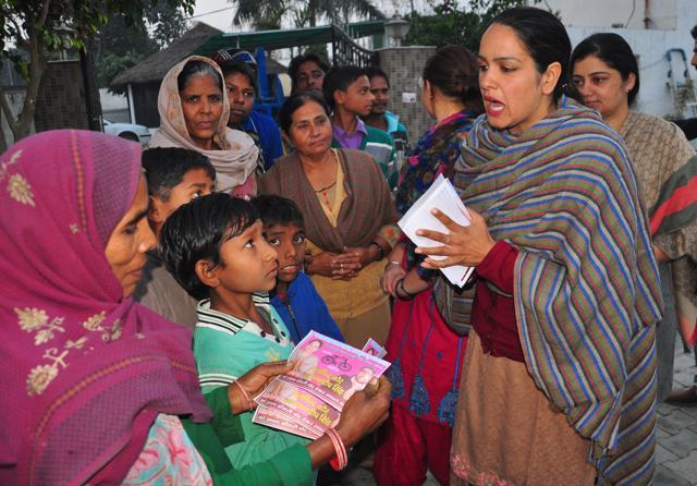 Palwinder Kaur, 34, campaigning for the post of sarpanch. (HT Photo )