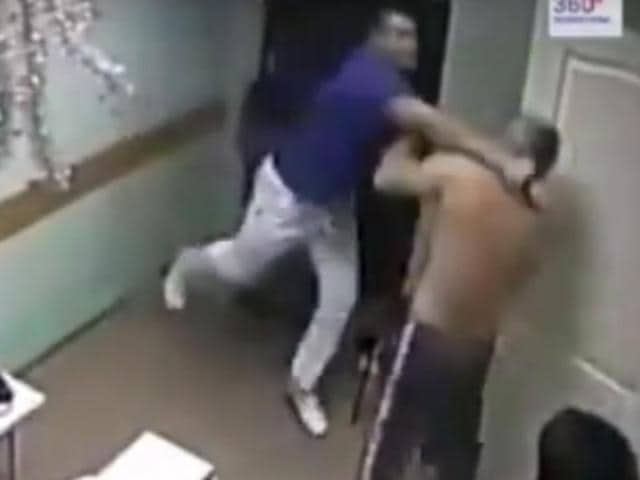 In the video, the strongly-built doctor of a Belgorod hospital in southern Russia punches the barechested male patient asking him “why did you touch the nurse?”.