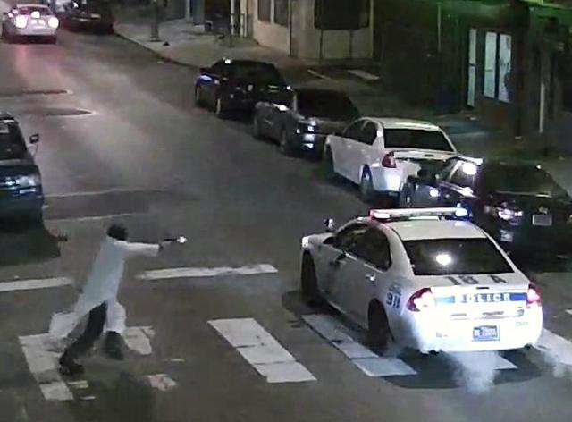 In this frame from a Thursday, Jan. 7, 2016 video provided by the Philadelphia Police Department, Edward Archer runs with a gun toward a police car driven by Officer Jesse Hartnett in Philadelphia. Archer, using a gun stolen from police, said he was acting in the name of Islam when he ambushed Hartnett sitting in his marked cruiser at an intersection, firing shots at point-blank range, authorities said. (AP) In this frame from a Thursday, Jan. 7, 2016 video provided by the Philadelphia Police Department, Edward Archer runs with a gun toward a police car driven by Officer Jesse Hartnett in Philadelphia. Archer, using a gun stolen from police, said he was acting in the name of Islam when he ambushed Hartnett sitting in his marked cruiser at an intersection, firing shots at point-blank range, authorities said. (AP)