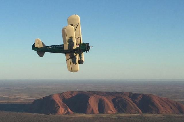 Taylor pilots her biplane past Australia's Uluru rock formation during her historic England-to-Australia journey. (REUTERS) Taylor pilots her biplane past Australia's Uluru rock formation during her historic England-to-Australia journey. (REUTERS)