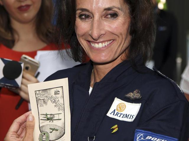 The aviator showing her gift to reporters after landing in Sydney. (AP) The aviator showing her gift to reporters after landing in Sydney. (AP)