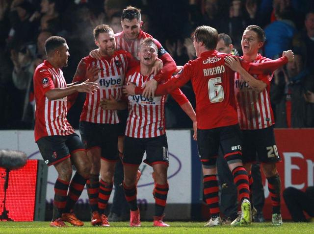 Exeter City's Lee Holmes celebrates scoring against Liverpool with teammates during the English FA Cup. (AP Photo) Exeter City's Lee Holmes celebrates scoring against Liverpool with teammates during the English FA Cup. (AP Photo)