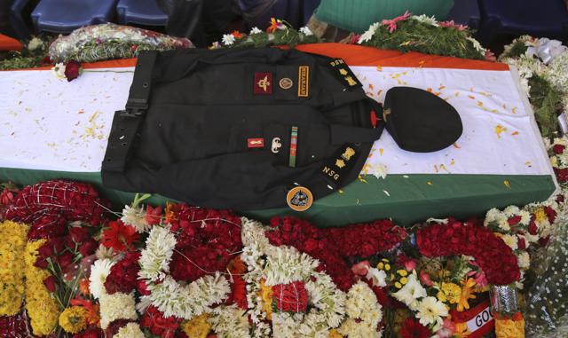The uniform of National Security Guard commando Niranjan Kumar, who was among those killed in the attack on the Pathankot air force base is placed on his coffin draped in the Indian flag, in Bangalore. (AP Photo) The uniform of National Security Guard commando Niranjan Kumar, who was among those killed in the attack on the Pathankot air force base is placed on his coffin draped in the Indian flag, in Bangalore. (AP Photo)