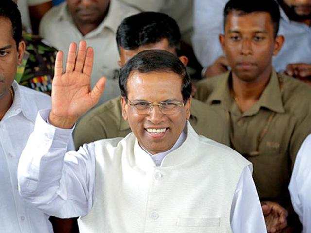 President Maithripala Sirisena welcomed the former rebel onto the stage and blessed him by touching him on his head.(AP File Photo)