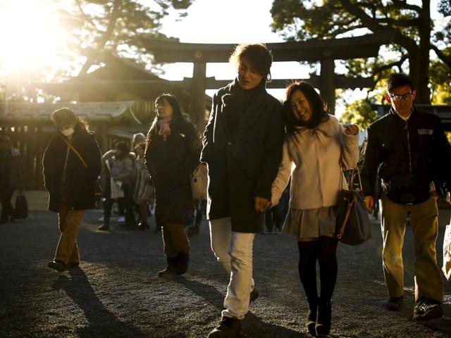 People leave the Shinto Meiji Shrine after New Year prayers in Tokyo. (REUTERS) People leave the Shinto Meiji Shrine after New Year prayers in Tokyo. (REUTERS)