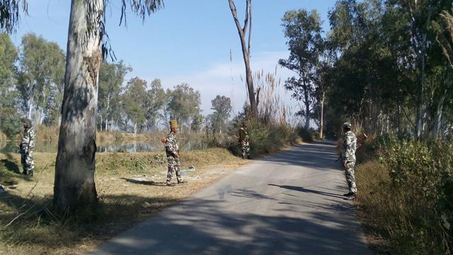 Security personnel on guard at the Tibri village near Tibri Military Station on Saturday. (Kamaljit Singh Kamal/HT Photo)