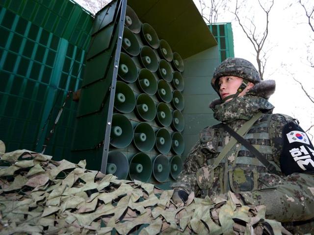 A South Korean soldier operates loudspeakers, just south of the demilitarized zone separating the two Koreas, in Yeoncheon. South Korea on Friday unleashed a ear-splitting propaganda barrage over its border with the North. (REUTERS) A South Korean soldier operates loudspeakers, just south of the demilitarized zone separating the two Koreas, in Yeoncheon. South Korea on Friday unleashed a ear-splitting propaganda barrage over its border with the North. (REUTERS)