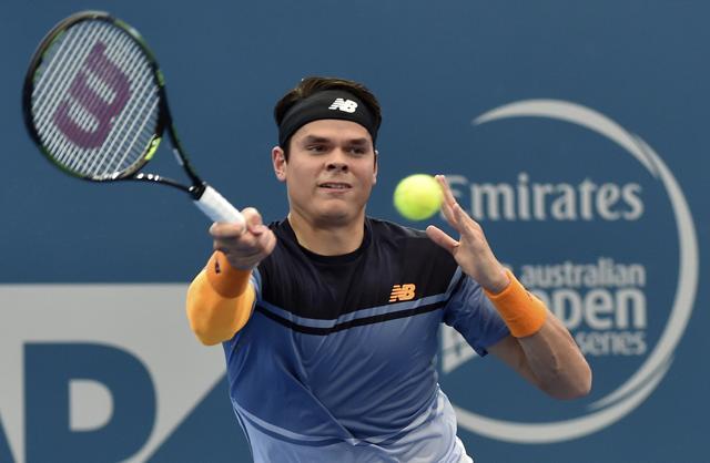 Milos Raonic hits a return against Australia's Bernard Tomic during their men's singles semi-final match of the Brisbane International tennis tournament. (AFP Photo) Milos Raonic hits a return against Australia's Bernard Tomic during their men's singles semi-final match of the Brisbane International tennis tournament. (AFP Photo)