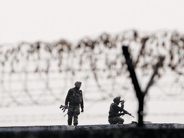 Security personnel stand inside the Pathankot air force base after the military operation against terrorists ended, in Punjab.(Sameer Sehgal/HT Photo)