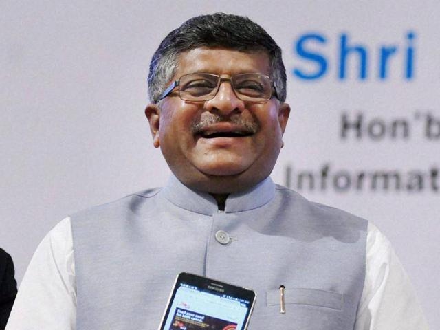 Union minister for communications & information technology Ravi Shankar Prasad along with BSE chairman S Ramadorai during the launch of free Wi-Fi service at BSE in Mumbai on Sunday.(PTI)