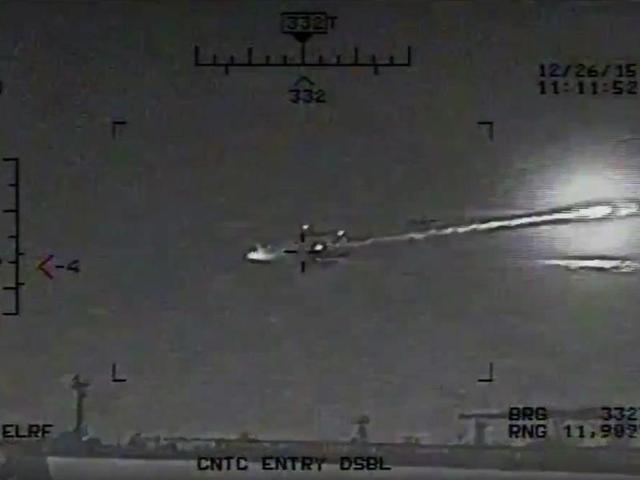 This image made from video released by the US Navy on Saturday shows the view from a Seahawk helicopter in the Strait of Hormuz on December 26, 2015. The US Navy says the video shows a rocket fired from an Iranian Revolutionary Guard vessel near warships and commercial traffic in the strategic strait. (AP) This image made from video released by the US Navy on Saturday shows the view from a Seahawk helicopter in the Strait of Hormuz on December 26, 2015. The US Navy says the video shows a rocket fired from an Iranian Revolutionary Guard vessel near warships and commercial traffic in the strategic strait. (AP)