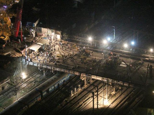 Workers begin dismantling Hancock Bridge on Saturday. (Bhushan Koyande)