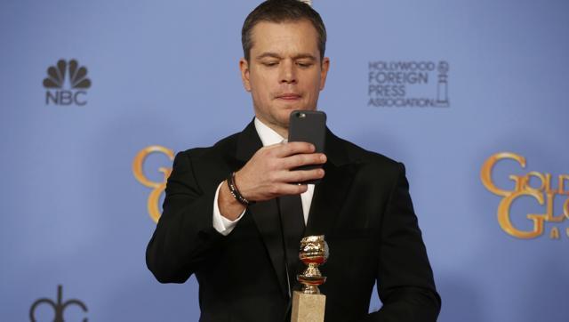 Matt Damon takes a selfie as he poses backstage with the award for Best Performance by an Actor in a Motion Picture - Musical or Comedy for his role in The Martian at the 73rd Golden Globe Awards in Beverly Hills, California January 10, 2016. (REUTERS) Matt Damon takes a selfie as he poses backstage with the award for Best Performance by an Actor in a Motion Picture - Musical or Comedy for his role in The Martian at the 73rd Golden Globe Awards in Beverly Hills, California January 10, 2016. (REUTERS)