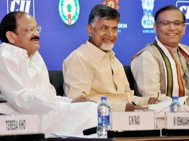 Union ministers M Venkaiah Naidu and Jayant Sinha along with Andhra Pradesh chief minister N Chandrababu Naidu on the second day of the CII-Partnership Summit in Visakhapatnam on Monday.(PTI)