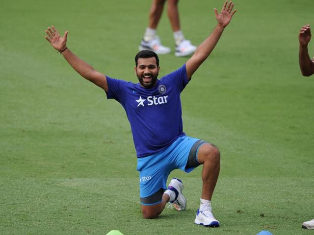 Rohit Sharma warms up with a game of football prior to the start of the Australia series. (AFP Photo)
