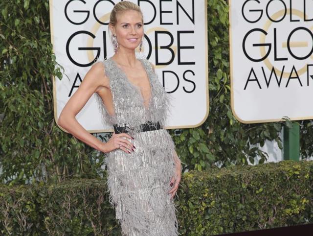 How do you make a supermodel like Heidi Klum look bad at the red carpet? By making her wear a terrible dress and adding a horrible belt to it. (AP) 