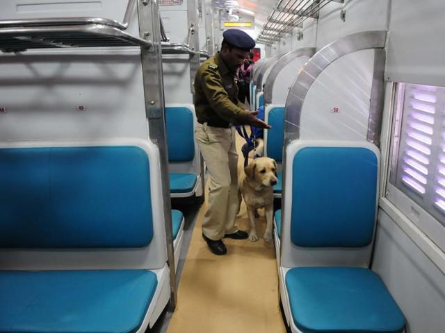 A sniffer dog checks the model coach before inspection by the Railways Board chairman AK Mittal, at the Habibganj railway station. (Mujeeb Faruqui/HT Photo)