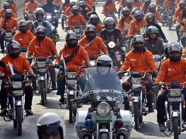 Women participants of Women on Wheels (WOW) ride their motor-bikes during a rally launching the Women on Wheels campaign in Lahore. (AFP) Women participants of Women on Wheels (WOW) ride their motor-bikes during a rally launching the Women on Wheels campaign in Lahore. (AFP)