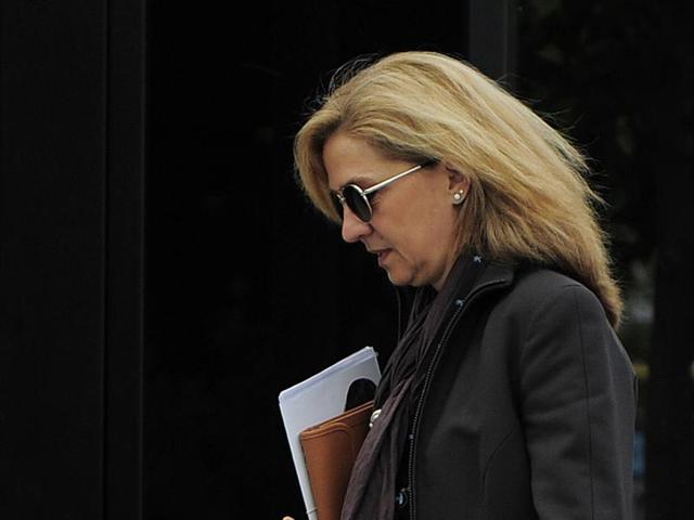 In this April 5, 2013 file photo, Spain's princess Cristina is photographed as she walks toward her office in Barcelona, Spain. (AP) In this April 5, 2013 file photo, Spain's princess Cristina is photographed as she walks toward her office in Barcelona, Spain. (AP)