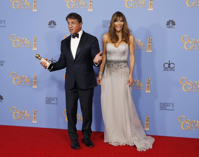 Sylvester Stallone poses backstage with his wife Jennifer Flavin as holds the award for Best Performance by an Actor in a Supporting Role in any Motion Picture at the 73rd Golden Globe Awards in Beverly Hills, California January 10, 2016. (REUTERS) Sylvester Stallone poses backstage with his wife Jennifer Flavin as holds the award for Best Performance by an Actor in a Supporting Role in any Motion Picture at the 73rd Golden Globe Awards in Beverly Hills, California January 10, 2016. (REUTERS)