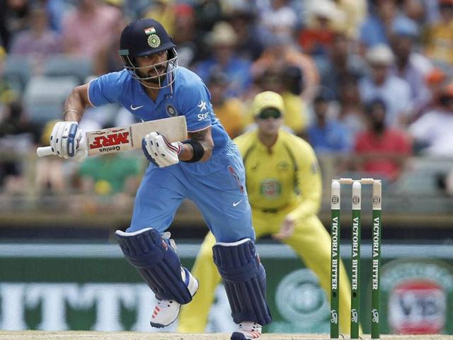 India's Virat Kohli runs down the wicket during their one day international cricket match against Australia in Perth. (AP Photo)