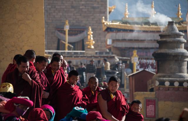 Lamas watch the Cham dance during the Gedong festival at the Ganden Sumtsenling Monastery in Shangri-La, Diqing Tibetan Autonomous Prefecture of southwest China's Yunnan Province. (AFP)
