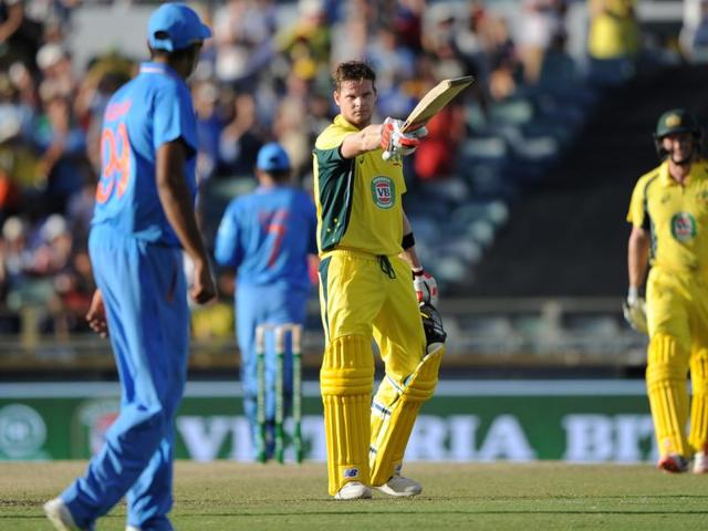 Australia's captain Steve Smith raises his bat after reaching his century. (AFP Photo)