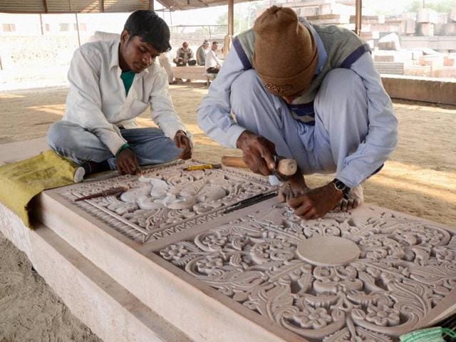 File photo of artists carving stones at a workshop at Karsevakpuram in Ayodhya. The Vishva Hindu Parishad is planning to showcase models of the proposed Ram temple at Ayodhya and many other things on Ram Navami this year. (PTI) File photo of artists carving stones at a workshop at Karsevakpuram in Ayodhya. The Vishva Hindu Parishad is planning to showcase models of the proposed Ram temple at Ayodhya and many other things on Ram Navami this year. (PTI)