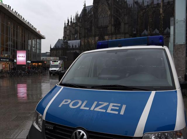 A woman looks at flowers and letters of protest that are laid down on the steps in front of the Cologne main train station in Cologne, western Germany on January 11, 2016. German authorities said that nearly all the suspects in a rash of New Year's Eve violence against women in Cologne were "of foreign origin", as foreigners came under attack amid surging tensions. (AFP Photo) A woman looks at flowers and letters of protest that are laid down on the steps in front of the Cologne main train station in Cologne, western Germany on January 11, 2016. German authorities said that nearly all the suspects in a rash of New Year's Eve violence against women in Cologne were "of foreign origin", as foreigners came under attack amid surging tensions. (AFP Photo)