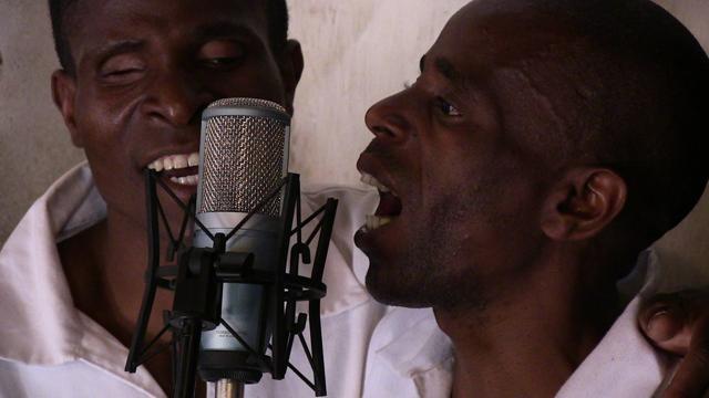 In this photo taken August 24, 2014 and supplied by the Zomba Prison Project, members of the Zomba Prison group record songs at the Zomba prison, in southern Malawi. (AP)