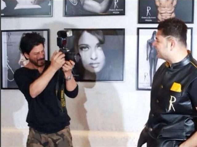 Shah Rukh Khan goes behind the camera to click photographer Dabboo Ratnani. SRK launched the star photographer’s calendar on Wednesday in Mumbai. (Instagram)