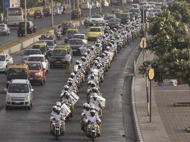 Police bikers drive past Marine Drive after CM Devendra Fadnavis flagged-off a rally on Tuesday. (Arijit Sen/HT photo) Police bikers drive past Marine Drive after CM Devendra Fadnavis flagged-off a rally on Tuesday. (Arijit Sen/HT photo)