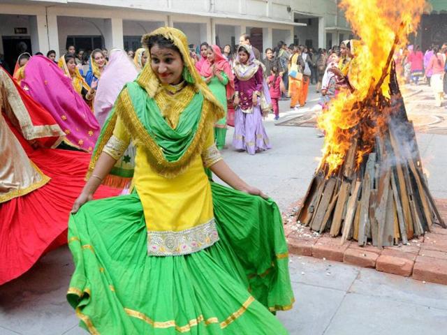 Lighting of bonfire is a key part of the Lohri tradition and signifies the return of longer days. It is celebrated a day before Maghi. (PTI)