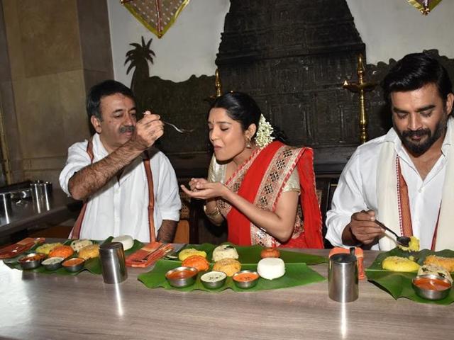 Boxer-turned-actor Ritika Singh enjoys the Pongal-special food with filmmaker Rajkumar Hirani and actor R Madhavan. (UTV MOtion Pictures) Boxer-turned-actor Ritika Singh enjoys the Pongal-special food with filmmaker Rajkumar Hirani and actor R Madhavan. (UTV MOtion Pictures)