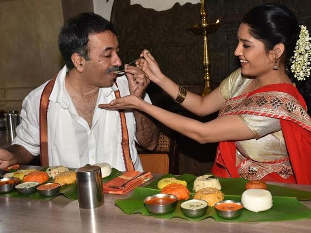 Ritika Singh looks quite excited as she offers food to director Rajkumar Hirani. She makes her Bollywood debut in Hirani’s production, Saala Khadoos. (UTV MOtion Pictures) Ritika Singh looks quite excited as she offers food to director Rajkumar Hirani. She makes her Bollywood debut in Hirani’s production, Saala Khadoos. (UTV MOtion Pictures)