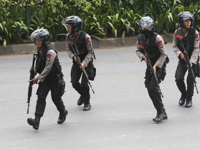 Police officers rush to take their position at the site of an attack in Jakarta. Attackers set off explosions at a Starbucks cafe in a bustling shopping area in Indonesia's capital and waged gunbattles with police. (AP) Police officers rush to take their position at the site of an attack in Jakarta. Attackers set off explosions at a Starbucks cafe in a bustling shopping area in Indonesia's capital and waged gunbattles with police. (AP)