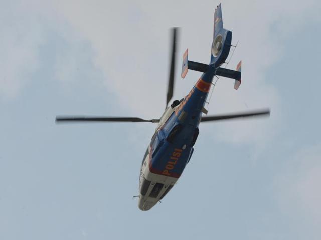 Indonesian police monitor the situation from a helicopter as armed men exchange shots with police in Jakarta. (AFP Photo) 