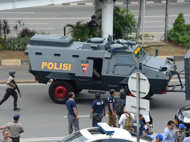 Indonesian police commandos secure the area outside a damaged Starbucks coffee shop after a series of explosions hit central Jakarta. (AFP Photo) Indonesian police commandos secure the area outside a damaged Starbucks coffee shop after a series of explosions hit central Jakarta. (AFP Photo)
