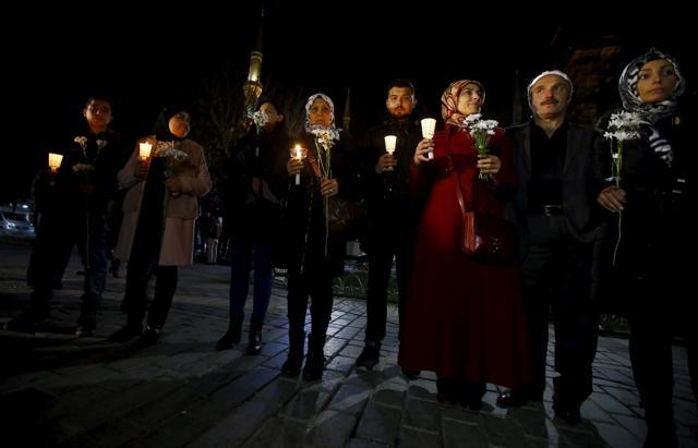 Syrians living in Istanbul hold candles and flowers at the site of the suicide bomb attack at Sultanahmet square in Istanbul, Turkey. (Reuters Photo) Syrians living in Istanbul hold candles and flowers at the site of the suicide bomb attack at Sultanahmet square in Istanbul, Turkey. (Reuters Photo)