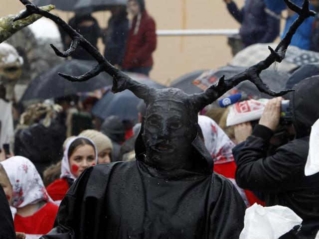 A masked reveller participates in the carnival in Vevcani. Held on St. Basil’s Day, it marks the beginning of the New Year by the Julian calendar. (AP)